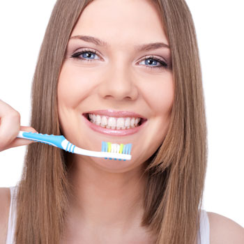 Woman getting ready to brush her teeth
