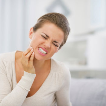 A woman suffering from jaw pain