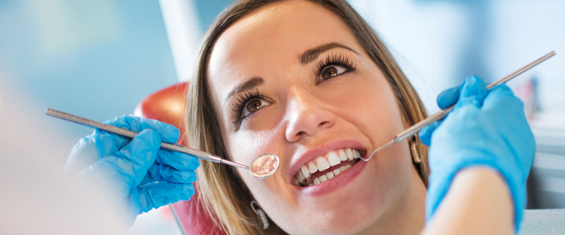 Dentist getting ready to examine patient teeth